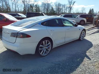 2016 Tesla Model S 90D with VIN 5YJSA1E2XGF171288, listed as a IAAI auction lot 41766075 with 112,927 mi miles. Bid and sale history available at carsss.com. Image 4.