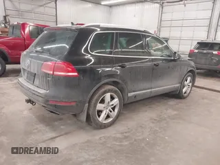 2012 Volkswagen Touareg Sport with VIN WVGEF9BP8CD009511, listed as a IAAI auction lot 41457989 with 87,325 mi miles and . Bid and sale history available at DreamBid. Image 4.