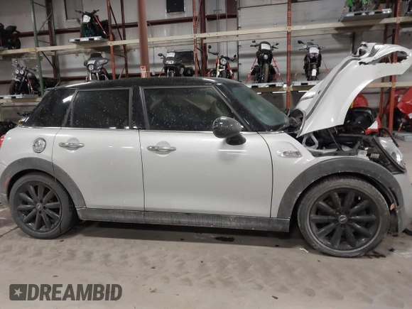 2015 MINI Hardtop 4 Door S with VIN WMWXU3C56F2B66449, listed as a IAAI auction lot 41296784 with 53,589 mi miles and . Bid and sale history available at DreamBid. Image 13.