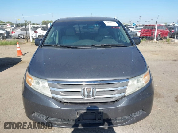 2012 Honda Odyssey EX-L with VIN 5FNRL5H6XCB061026, listed as a IAAI auction lot 42574612 with 144,480 mi miles and . Bid and sale history available at DreamBid. Image 6.