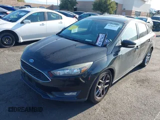 2015 Ford Focus SE with VIN 1FADP3F22FL306055, listed as a IAAI auction lot 41966475 with 139,228 mi miles. Bid and sale history available at carsss.com. Image 2.
