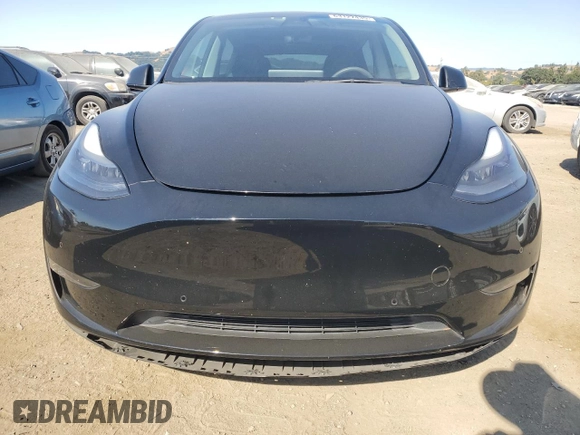 2022 Tesla Model Y Performance with VIN 7SAYGDEF1NF486218, listed as a Copart auction lot 63127435 with 99,302 mi miles and Salvage title. Bid and sale history available at DreamBid. Image 5.