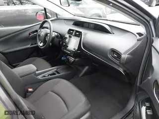 2021 Toyota Prius L Eco with VIN JTDKAMFU2M3143138, listed as a IAAI auction lot 41658263 with 102,718 mi miles. Bid and sale history available at carsss.com. Image 5.