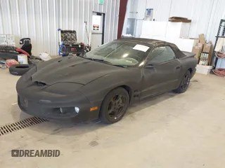 2000 Pontiac Firebird Firebird z VIN 2G2FS32KXY2146392, wystawiony jako IAAI lot #42506629 z przebiegiem 161 077 mil mil oraz . Historia ofert i sprzedaży dostępna na DreamBid. Obrazek 2.