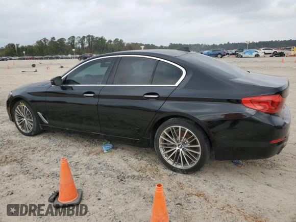 2018 BMW 5 Series 530i with VIN WBAJA5C54JG899845, listed as a Copart auction lot 83007584 with 57,379 mi miles and Salvage Title. Bid and sale history available at DreamBid. Image 2.