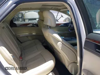 2014 Lincoln MKZ z VIN 3LN6L2GK6ER817934, wystawiony jako IAAI lot #42320672 z przebiegiem 103 710 mil mil oraz . Historia ofert i sprzedaży dostępna na DreamBid. Obrazek 8.