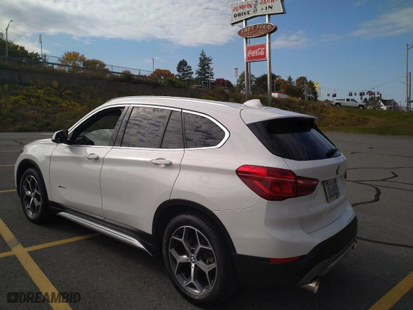 2016 BMW X1 xDrive28i with VIN WBXHT3C3XGP880243, listed as a Copart auction lot 54556895 with 57,200 mi miles and Clean Title. Bid and sale history available at carsss.com. Image 3.