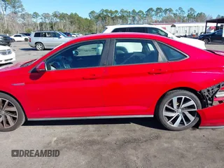 2019 Volkswagen Jetta GLI S z VIN 3VW5T7BU3KM225015, wystawiony jako IAAI lot #41352228 z przebiegiem 96 874 mil mil oraz . Historia ofert i sprzedaży dostępna na DreamBid. Obrazek 14.