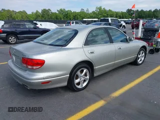 2002 Mazda Millenia with VIN JM1TA221721722364, listed as a IAAI auction lot 42160683 with 166,778 mi miles and . Bid and sale history available at DreamBid. Image 4.