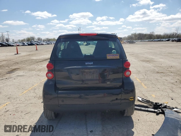 2009 Smart fortwo Pure z VIN WMEEJ31X49K219479, wystawiony jako Copart lot #52446625 z przebiegiem 82 337 mil mil oraz Szkody całkowita. Historia ofert i sprzedaży dostępna na DreamBid. Obrazek 6.