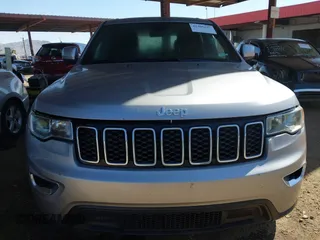 2018 Jeep Grand Cherokee Laredo E with VIN 1C4RJEAG3JC399869, listed as a IAAI auction lot 42305627 with 64,004 mi miles and . Bid and sale history available at DreamBid. Image 6.