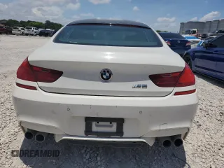 2014 BMW M6 with VIN WBS6C9C55ED467226, listed as a Copart auction lot 61779015 with Not provided miles and Salvage title. Bid and sale history available at DreamBid. Image 6.