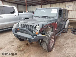 2010 Jeep Wrangler Unlimited Sport with VIN 1J4BA3H13AL125010, listed as a IAAI auction lot 41734482 with 183,773 mi miles. Bid and sale history available at carsss.com. Image 2.