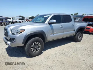 2018 Toyota Tacoma SR with VIN 3TMCZ5AN6JM129370, listed as a Copart auction lot 63042425 with 65,189 mi miles and Salvage title. Bid and sale history available at DreamBid. Image 1.