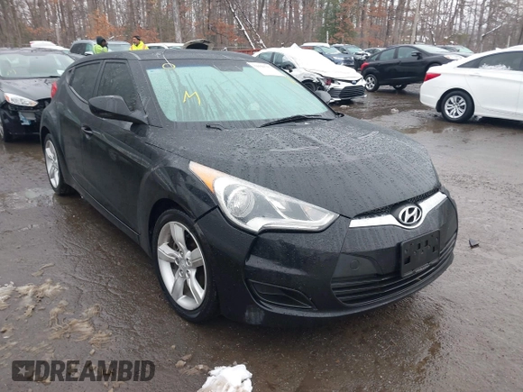 2012 Hyundai Veloster w/Black Int with VIN KMHTC6ADXCU024923, listed as a IAAI auction lot 41556793 with 101,923 mi miles and . Bid and sale history available at DreamBid. Image 1.