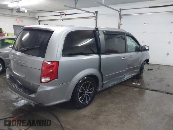 2015 Dodge Grand Caravan SE with VIN 2C4RDGBG9FR703691, listed as a IAAI auction lot 41395564 with 170,735 mi miles and . Bid and sale history available at DreamBid. Image 4.