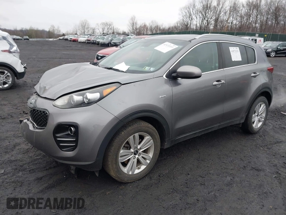 2017 Kia Sportage LX with VIN KNDPMCAC2H7238741, listed as a IAAI auction lot 41973333 with 64,714 mi miles and . Bid and sale history available at carsss.com. Image 2.