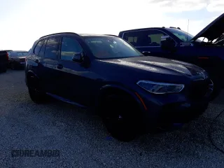 2022 BMW X5 sDrive40i with VIN 5UXCR4C08N9M98312, listed as a Copart auction lot 69814452 with 2,495 mi miles. Bid and sale history available at carsss.com. Image 4.