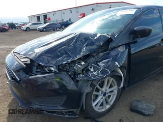 2018 Ford Focus SE z VIN 1FADP3F20JL288437, wystawiony jako IAAI lot #42278885 z przebiegiem 132 504 mil mil oraz . Historia ofert i sprzedaży dostępna na DreamBid. Obrazek 6.