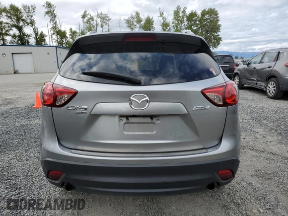 2014 Mazda CX-5 Touring z VIN JM3KE4CY0E0407169, wystawiony jako Copart lot #57877215 z przebiegiem 168 277 mil mil oraz Szkoda całkowita • Salvage title. Historia ofert i sprzedaży dostępna na DreamBid. Obrazek 6.