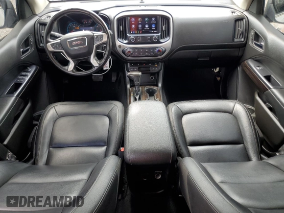 2020 GMC Canyon 2WD SLT z VIN 1GTG5DEN6L1172883, wystawiony jako Copart lot #71844604 z przebiegiem 81 504 mil mil oraz Czysty tytuł • Clean title. Historia ofert i sprzedaży dostępna na DreamBid. Obrazek 8.