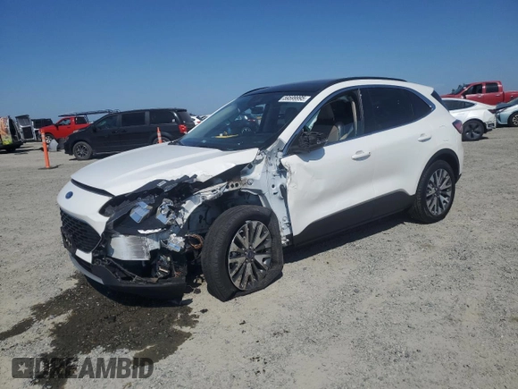 2020 Ford Escape Titanium Hybrid z VIN 1FMCU9DZ6LUC47658, wystawiony jako Copart lot #59599995 z przebiegiem 63 004 mil mil oraz Szkoda całkowita • Salvage title. Historia ofert i sprzedaży dostępna na DreamBid. Obrazek 1.