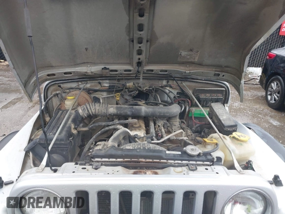 2006 Jeep Wrangler Sport Right Hand Drive with VIN 1J4F449SX6P764491, listed as a IAAI auction lot 41709726 with 290,798 mi miles. Bid and sale history available at carsss.com. Image 10.