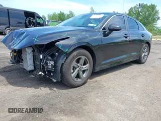2021 Kia K5 LXS z VIN 5XXG14J25MG052084, wystawiony jako IAAI lot #42237008 z przebiegiem 31 278 mil mil oraz . Historia ofert i sprzedaży dostępna na DreamBid. Obrazek 2.