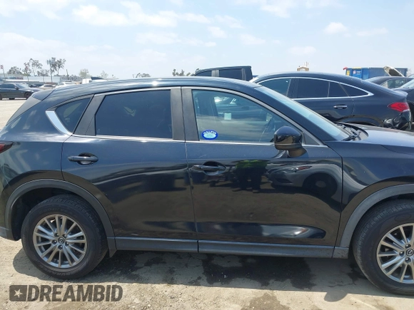 2017 Mazda CX-5 Touring with VIN JM3KFACL0H0124632, listed as a IAAI auction lot 42134971 with 107,029 mi miles and . Bid and sale history available at carsss.com. Image 13.