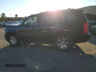 2011 GMC Yukon SLT with VIN 1GKS1CE01BR391954, listed as a Copart auction lot 82570594 with 0 mi miles and Salvage Title. Bid and sale history available at carsss.com. Image 2.