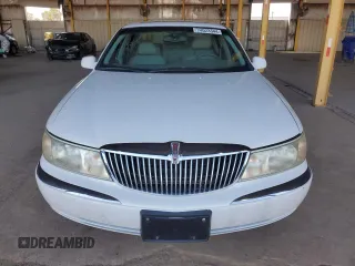 2001 Lincoln Continental with VIN 1LNHM97V31Y622782, listed as a Copart auction lot 74023344 with 116,672 mi miles and Salvage Title. Bid and sale history available at carsss.com. Image 5.