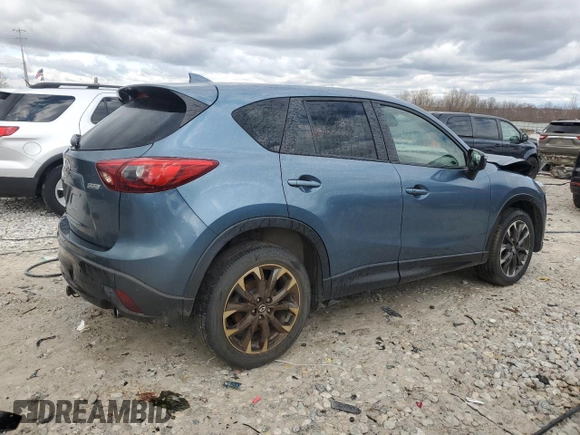 2016 Mazda CX-5 Grand Touring z VIN JM3KE4DY2G0637779, wystawiony jako Copart lot #52001805 z przebiegiem 184 381 mil mil oraz Czysty tytuł • Clean title. Historia ofert i sprzedaży dostępna na DreamBid. Obrazek 3.