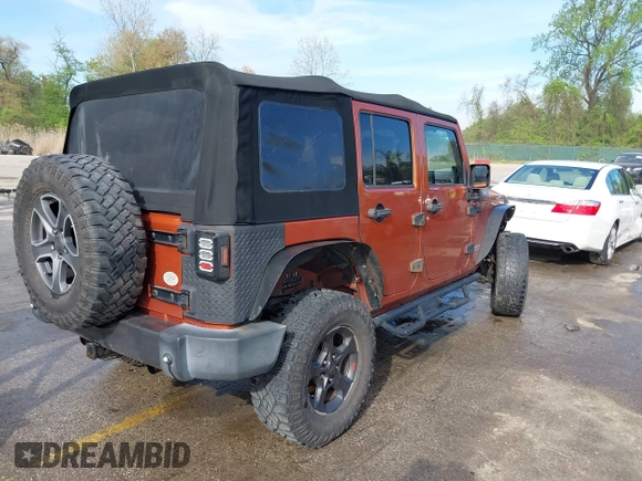 2010 Jeep Wrangler Unlimited Sport with VIN 1J4HA3H1XAL189667, listed as a IAAI auction lot 42062351 with 144,838 mi miles. Bid and sale history available at carsss.com. Image 4.