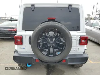 2023 Jeep Wrangler Sahara with VIN 1C4JJXP63PW536694, listed as a Copart auction lot 63409845 with 32,560 mi miles and Salvage title. Bid and sale history available at DreamBid. Image 6.