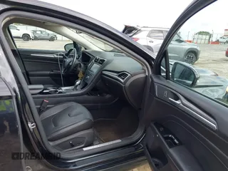 2013 Ford Fusion Titanium z VIN 3FA6P0K94DR375113, wystawiony jako IAAI lot #42265790 z przebiegiem 152 160 mil mil oraz . Historia ofert i sprzedaży dostępna na DreamBid. Obrazek 5.