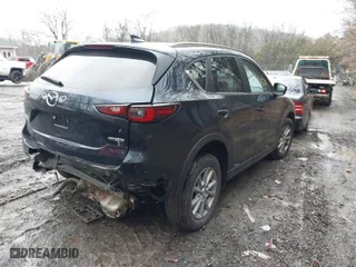 2023 Mazda CX-5 2.5 S Carbon Edition with VIN JM3KFBCM3P0244020, listed as a IAAI auction lot 41693880 with 26,342 mi miles. Bid and sale history available at carsss.com. Image 4.