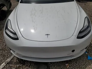 2020 Tesla Model Y Long Range z VIN 5YJYGDEF3LF028061, wystawiony jako Copart lot #57493175 z przebiegiem Nie podano mil oraz Czysty tytuł • Clean title. Historia ofert i sprzedaży dostępna na DreamBid. Obrazek 11.