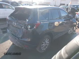 2016 Mazda CX-5 Touring with VIN JM3KE4CY0G0751040, listed as a IAAI auction lot 41290780 with 136,689 mi miles. Bid and sale history available at carsss.com. Image 4.
