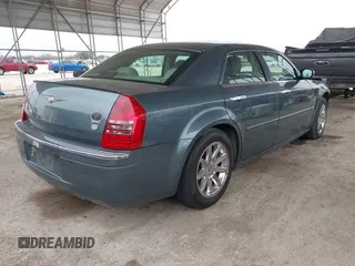 2006 Chrysler 300 C with VIN 2C3KA63H66H318725, listed as a IAAI auction lot 41629398 with 157,367 mi miles. Bid and sale history available at carsss.com. Image 4.