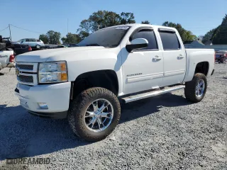 2012 Chevrolet Silverado 1500 LT with VIN 3GCPKSE70CG127566, listed as a Copart auction lot 76390764 with 151,661 mi miles and Salvage Title. Bid and sale history available at carsss.com. Image 1.