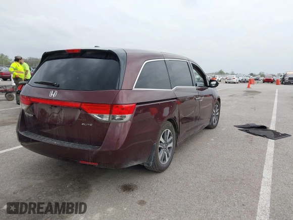 2014 Honda Odyssey Touring with VIN 5FNRL5H94EB127695, listed as a IAAI auction lot 41936109 with 221,786 mi miles and . Bid and sale history available at DreamBid. Image 4.