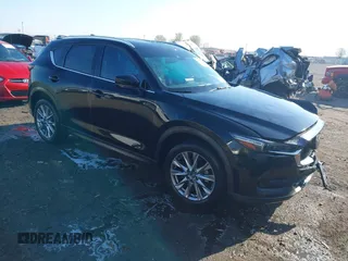 2020 Mazda CX-5 Grand Touring with VIN JM3KFBDM0L0790508, listed as a IAAI auction lot 41883319 with 114,398 mi miles and . Bid and sale history available at carsss.com. Image 1.