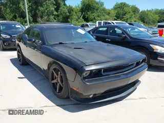 2013 Dodge Challenger R/T z VIN 2C3CDYBT9DH515902, wystawiony jako IAAI lot #42307804 z przebiegiem 114 675 mil mil oraz . Historia ofert i sprzedaży dostępna na DreamBid. Obrazek 1.