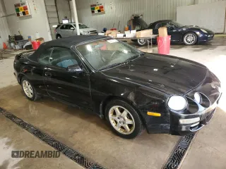 1997 Toyota Celica GT z VIN JT5FG02T3V0041206, wystawiony jako Copart lot #54601725 z przebiegiem 198 685 mil mil oraz Szkody całkowita. Historia ofert i sprzedaży dostępna na DreamBid. Obrazek 4.