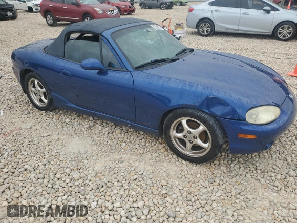 1999 Mazda MX-5 Miata with VIN JM1NB3532X0134801, listed as a Copart auction lot 83838374 with 97,015 mi miles and Salvage title. Bid and sale history available at DreamBid. Image 4.