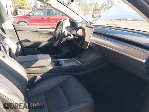 2023 Tesla Model Y Performance with VIN 7SAYGDEF3PF711497, listed as a IAAI auction lot 41877450 with 21,887 mi miles and . Bid and sale history available at DreamBid. Image 5.