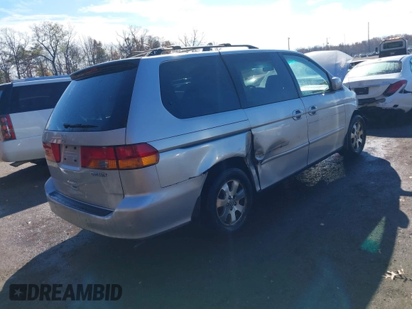 2004 Honda Odyssey EX z VIN 5FNRL18674B080319, wystawiony jako IAAI lot #40819411 z przebiegiem 201 820 mil mil oraz . Historia ofert i sprzedaży dostępna na DreamBid. Obrazek 4.