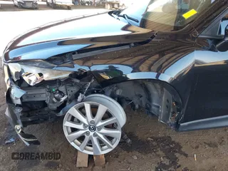 2016 Mazda CX-5 Sport with VIN JM3KE4BY8G0829002, listed as a IAAI auction lot 42553846 with 103,231 mi miles and . Bid and sale history available at DreamBid. Image 6.