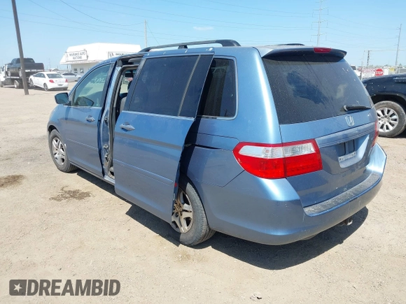 2005 Honda Odyssey EX-L with VIN 5FNRL387X5B083902, listed as a IAAI auction lot 42005085 with 249,861 mi miles. Bid and sale history available at carsss.com. Image 3.
