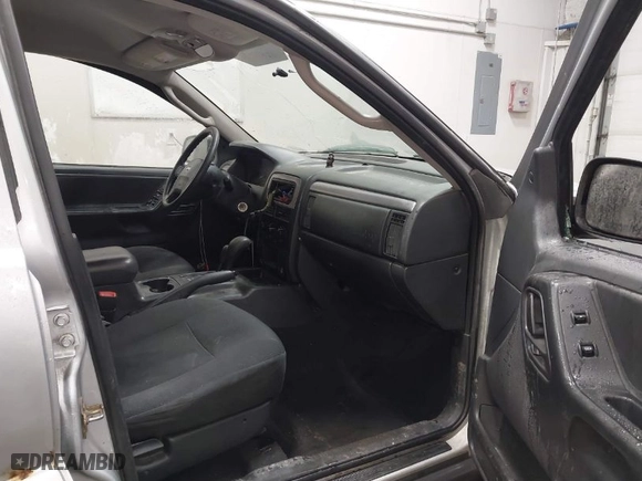2004 Jeep Grand Cherokee Laredo with VIN 1J4GW48S94C125054, listed as a IAAI auction lot 41788785 with 322,651 mi miles. Bid and sale history available at carsss.com. Image 5.